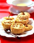 Cream of pumpkin soup with veal served in small pumpkins