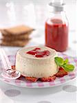 Rich tea biscuit panna cotta with strawberry-raspberry puree