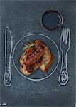 Bread with grilled sausages and a glass of wine; Plate,knife and fork drawn on the table