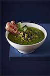 Split pea soup with black sesame seeds and bacon