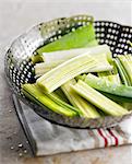 Sections of leeks in a metal steam basket