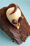 Edible mouse on a piece of chocolate cake