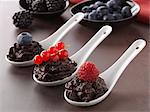 Spoonsful of chocolate mousse with summer fruit