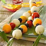 Cherry tomato,olive,melon ball and cheese aperitif brochettes