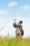 Young girl with camera on grassland