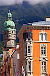 Austria, Tyrol, Innsbruck. Tower ancd part of a facade in the historical centre