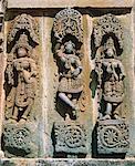 Asia, India, Karnataka.  Belur,  Chennakesava Temple.   Three women in ritual dancing poses.