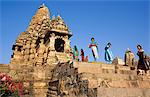 Asia, India, Madhya Pradesh, Khajuraho.  Kandariya Mahadev Temple, western group.   Indian tourists enjoy looking around.