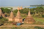 Myanmar, Burma, Mandalay Region, Bagan. Often used by tourists to visit Bagan's pagoda-dotted plain, a pony and trap moves through the site near the Irrawaddy River.