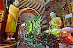 Myanmar, Burma, Sagaing Region, Monywa. Built in 1939, the Thanboddhay Paya, or temple, near Monywa is famed for its extraordinary array of Buddha statues, large and small, that fill its walls and ceilings.