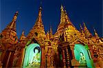 Myanmar, Burma, Yangon Region, Yangon. Numerous subsidiary Buddhist shrines ring the foot of Shwedagon Paya, the country's most famous and holiest pagoda.