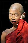 Myanmar, Burma, Rakhine State, Sittwe. A young monk at Shwezedi Kyaung.