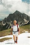 Mature man hiking in mountains, Tannheim Valley, Austria