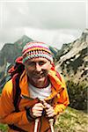 Close-up portrait of mature man hiking in mountains, Tannheim Valley, Austria