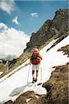 Backview of mature man hiking in mountains, Tannheim Valley, Austria