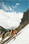 Mature man hiking in mountains, Tannheim Valley, Austria