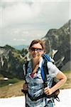 Portrait of mature woman hiking in mountains, Tannheim Valley, Austria