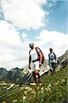 Mature couple hiking in mountains, Tannheim Valley, Austria