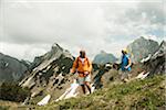 Mature couple hiking in mountains, Tannheim Valley, Austria