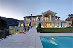 Swimming pool of luxury villa at dusk