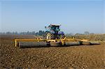 Tractor preparing the ground of field