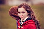 Portrait of girl walking with friend outdoors