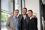 Portrait of three smiling businessmen