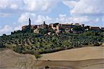 Ploughed fields and Tuscan town of Pienza, Italy