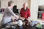 Senior couple preparing pastry