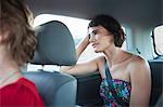 Young woman looking out of car window