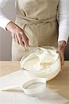 Woman whisking cream by hand