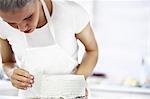 Woman decorating cake