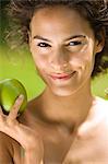 Young woman holding an apple