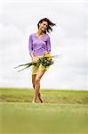 Young woman holding a bouquet of flowers