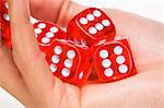 Woman's hand holding five dices