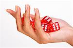 Woman's hand holding five dices