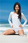 Young woman smiling on the beach