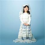 Little girl with wedding clothes