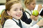 Canada, Québec, Montreal, private school, girl eating an apple