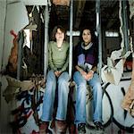 Two teenage girls in disused plant