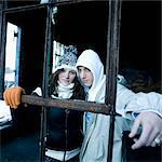 Two teenagers in disused plant