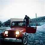 Man in his red 4WD, winter