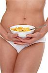 Woman in underwear holding cereal bowl