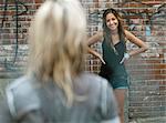 Teenage girls meeting in the street