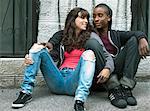 Teenagers sitting in the street