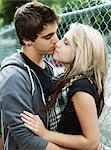 Teenagers kissing