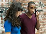 Teenagers using mobile phone