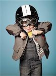 Little boy with old motorcycle helmet