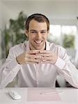 Smiling man with coffee cup