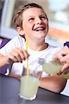 France, boy drinking a soda.